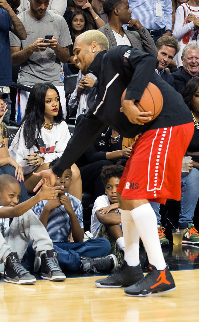 Rihanna Sits Courtside As Chris Brown Plays In Charity Basketball